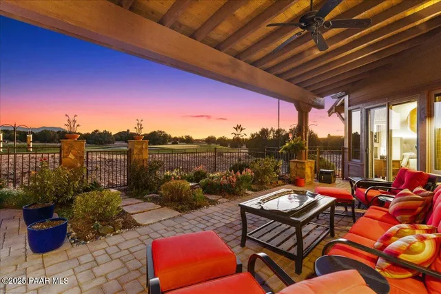 a view of a swimming pool with a table and chairs