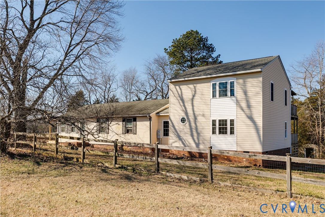 15105 Brown Pleasants Road Montpelier, VA 23192 - Photo 33 of 37 a white house with tall trees