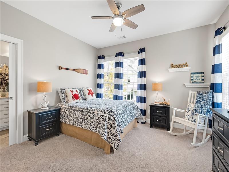 7380 Samples Field Road Cumming, GA 30040 - Photo 1 of 1 a bedroom with a bed and a cabinets