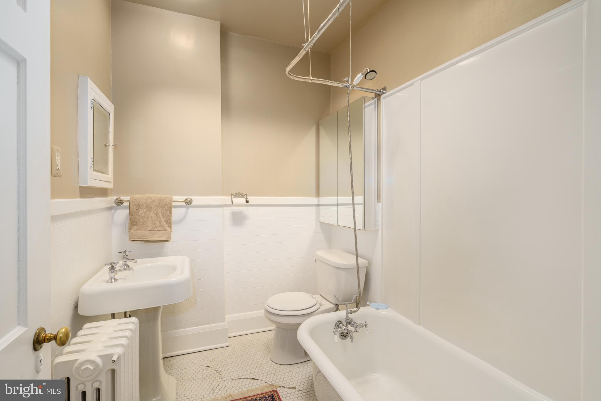 3749 Beech Avenue Baltimore, MD 21211 - Photo 18 of 34 a bathroom with a sink toilet and shower