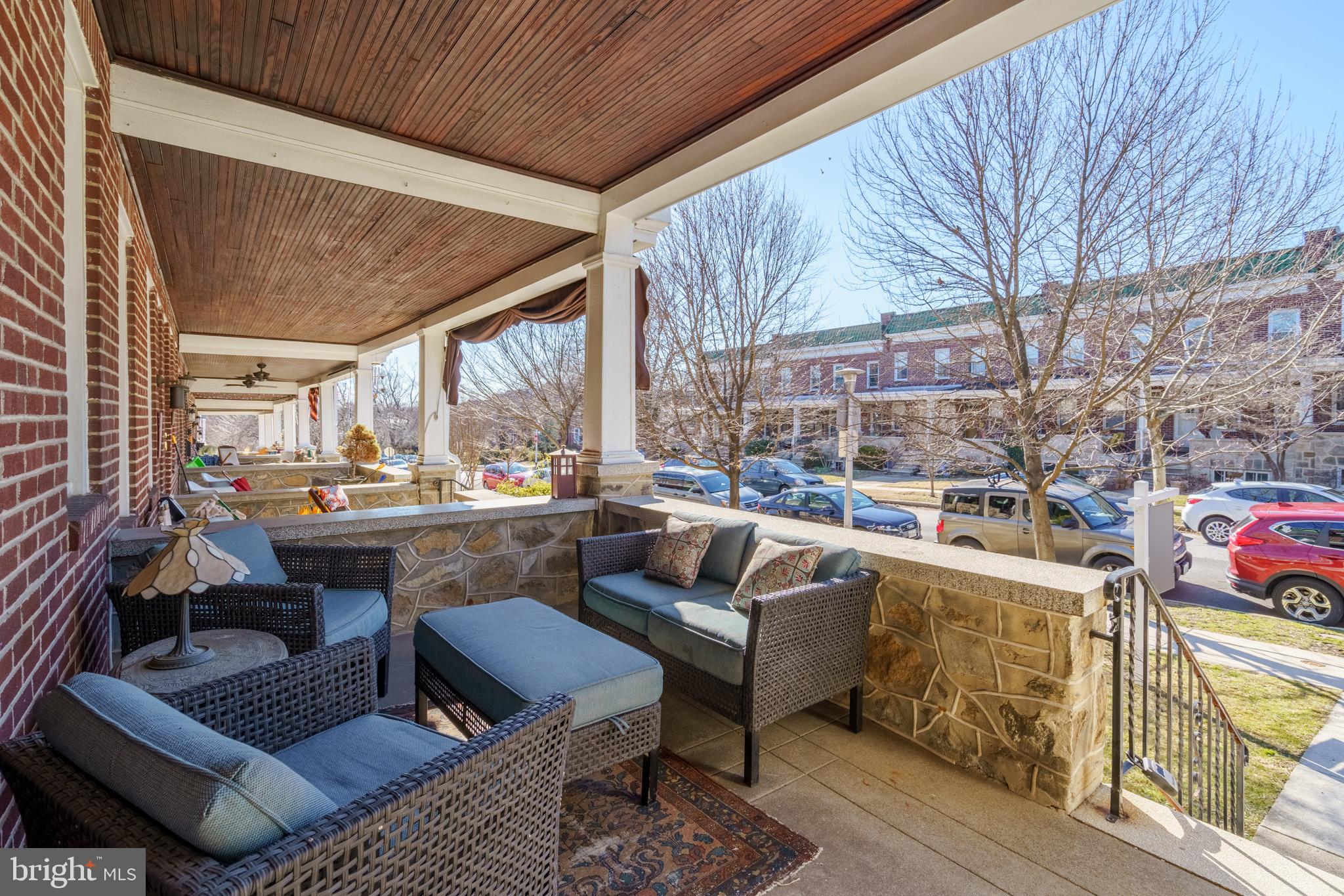 3749 Beech Avenue Baltimore, MD 21211 - Photo 2 of 34 a outdoor living space with patio furniture and a fireplace