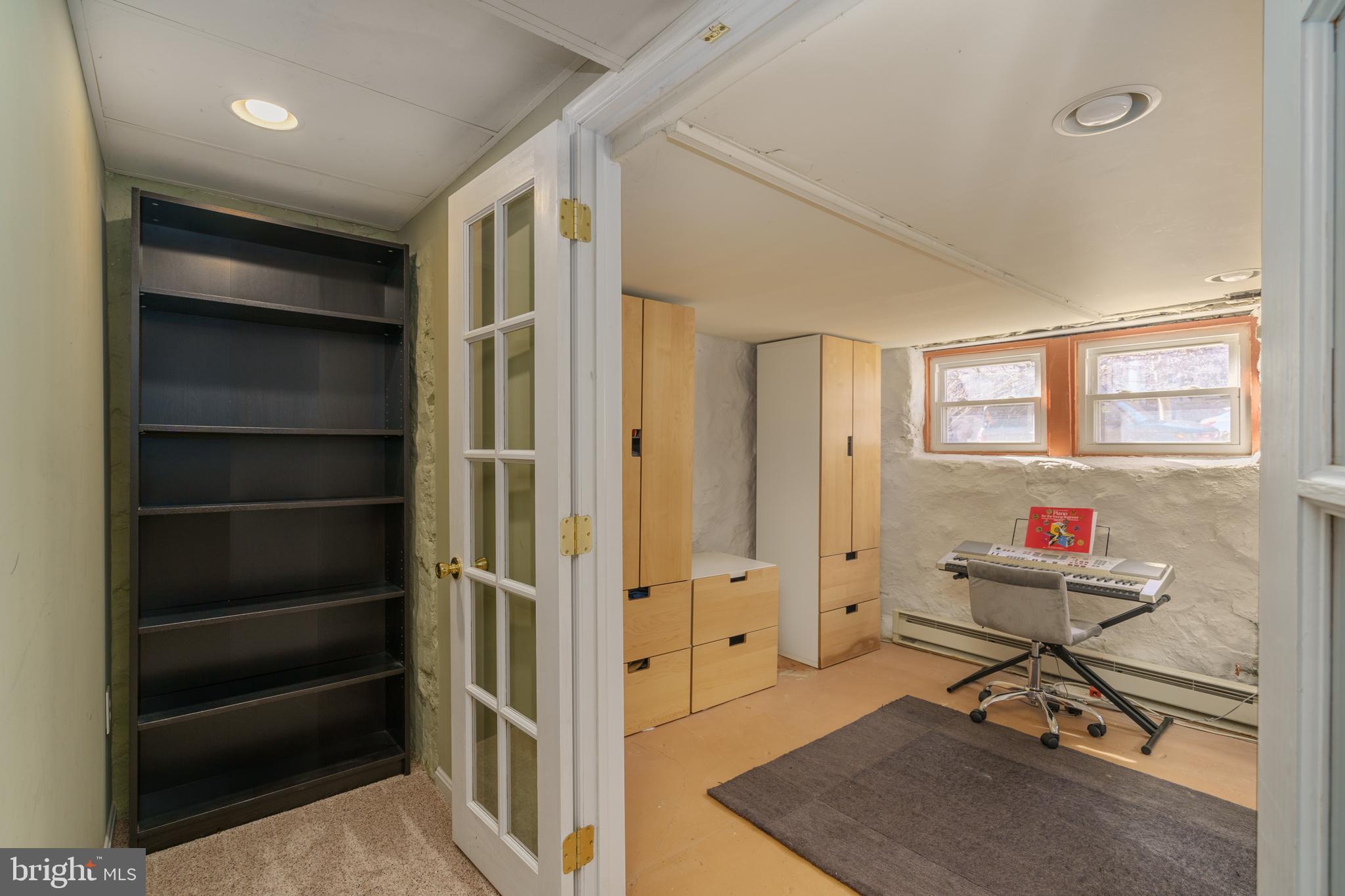 3749 Beech Avenue Baltimore, MD 21211 - Photo 24 of 34 a view of a workspace with furniture and windows