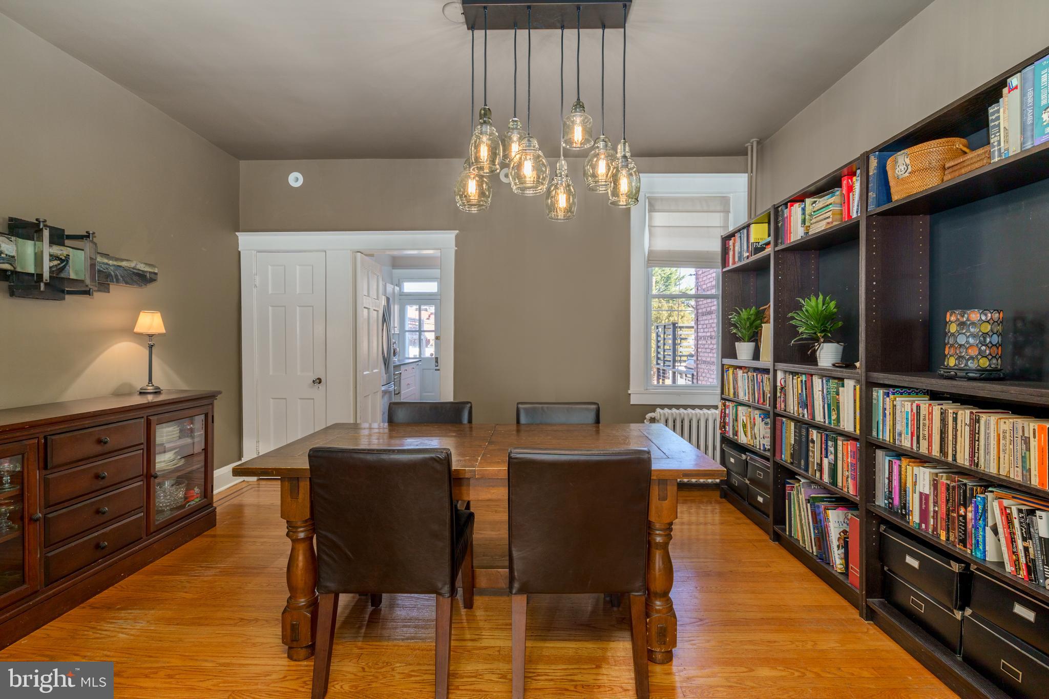 3749 Beech Avenue Baltimore, MD 21211 - Photo 6 of 34 a view of a dining room with furniture and a chandelier