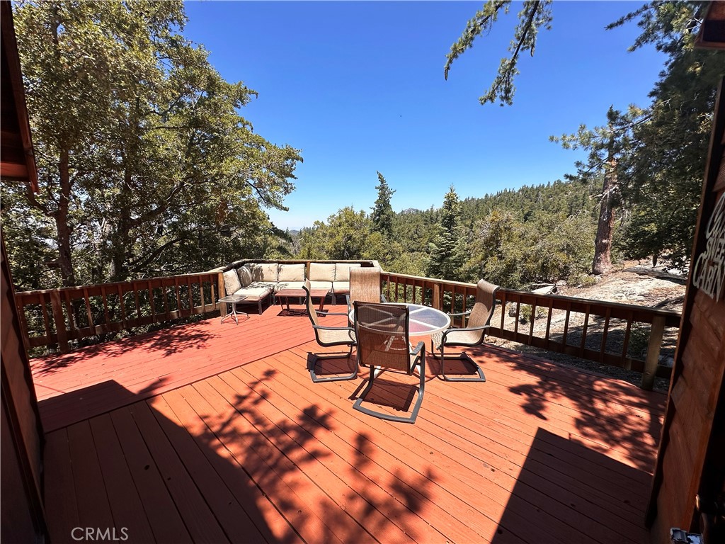 24387 Rocky Point Road Idyllwild, CA 92549 - Photo 14 of 29 a view of a balcony with chairs