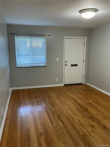 a kitchen with a stove and a refrigerator