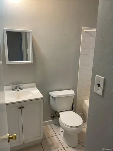 a bathroom with a toilet and a bathtub