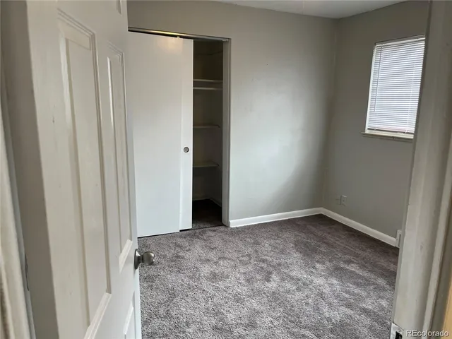 a white toilet sitting next to a shower