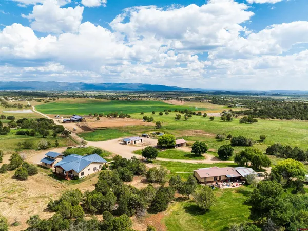 an aerial view of a houses with outdoor space