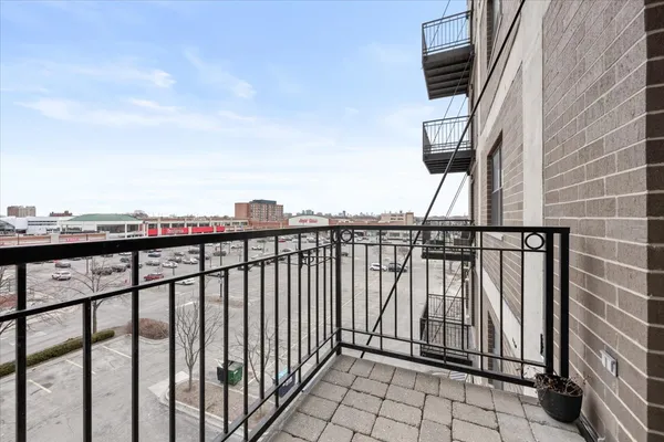a view of a balcony with wooden floor