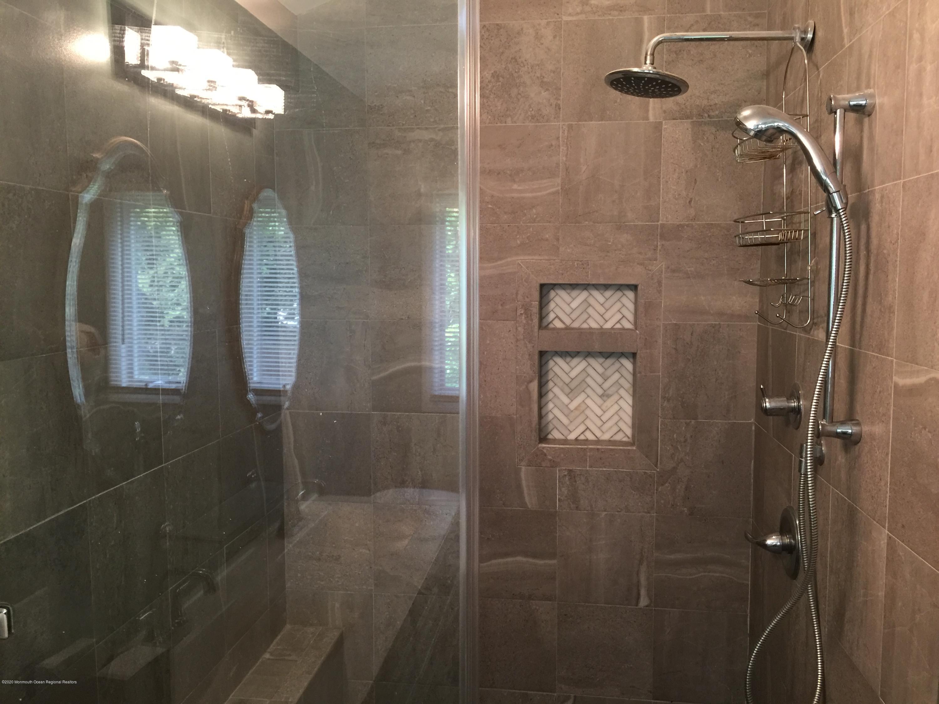 34 Shelbern Drive Lincroft, NJ 07738 - Photo 12 of 25 a bathroom with a mirror