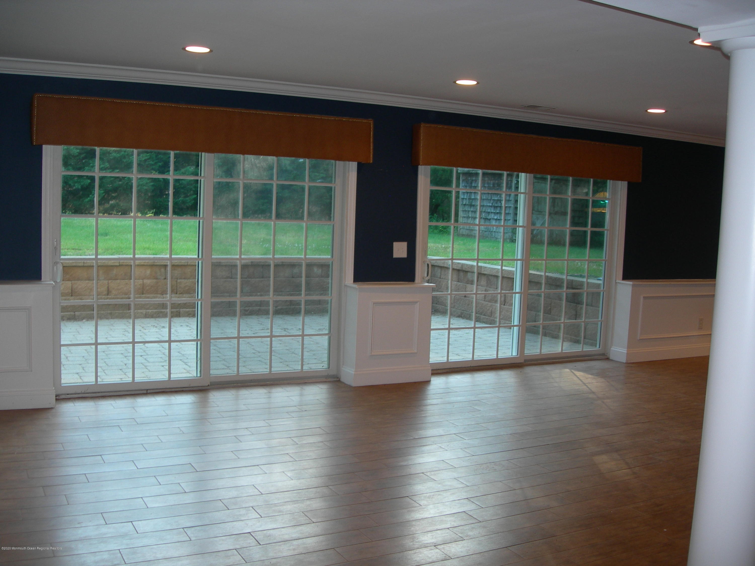 34 Shelbern Drive Lincroft, NJ 07738 - Photo 16 of 25 a view of empty room with wooden floor and fan
