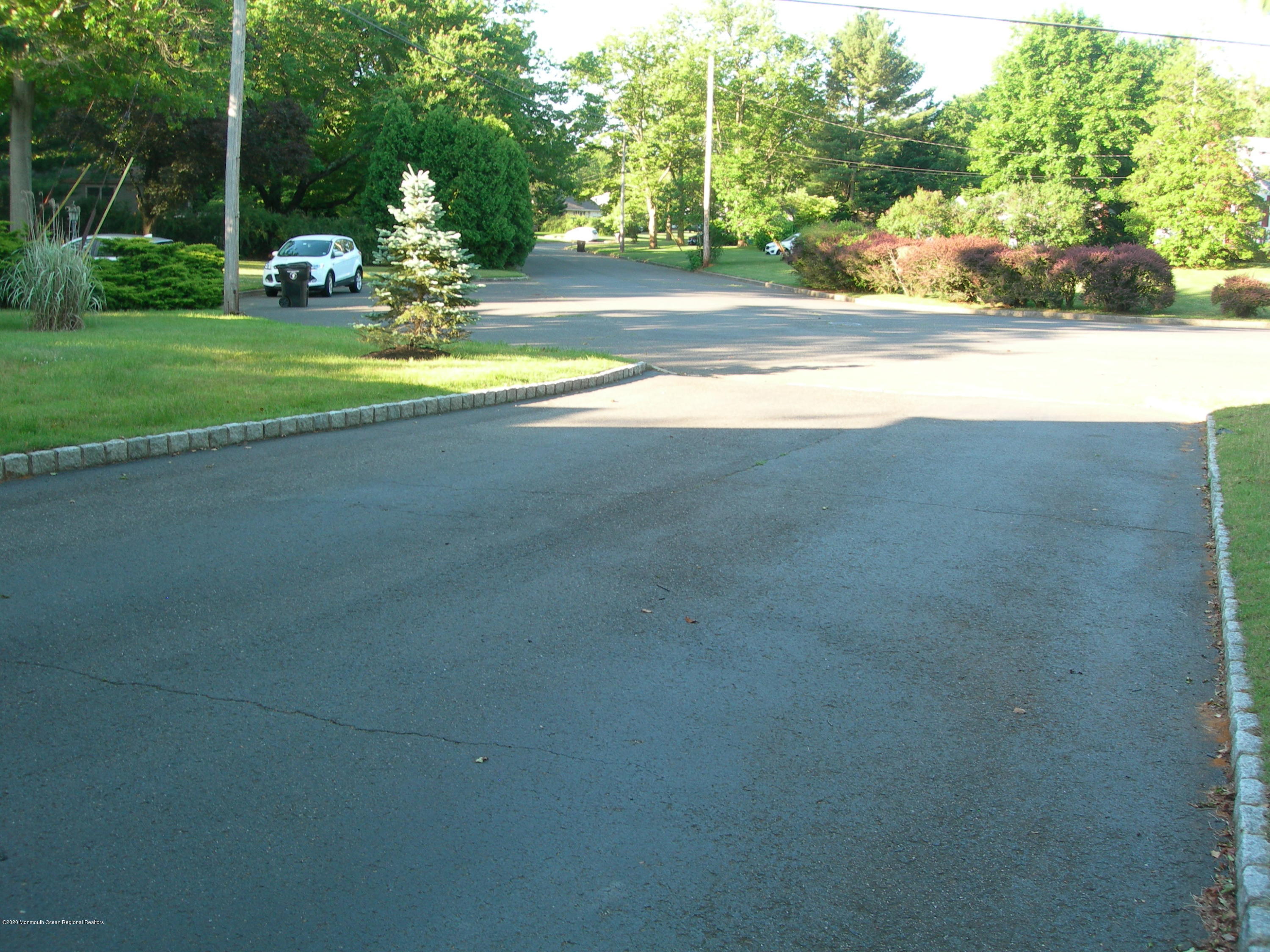 34 Shelbern Drive Lincroft, NJ 07738 - Photo 21 of 25 a view of a house with a yard
