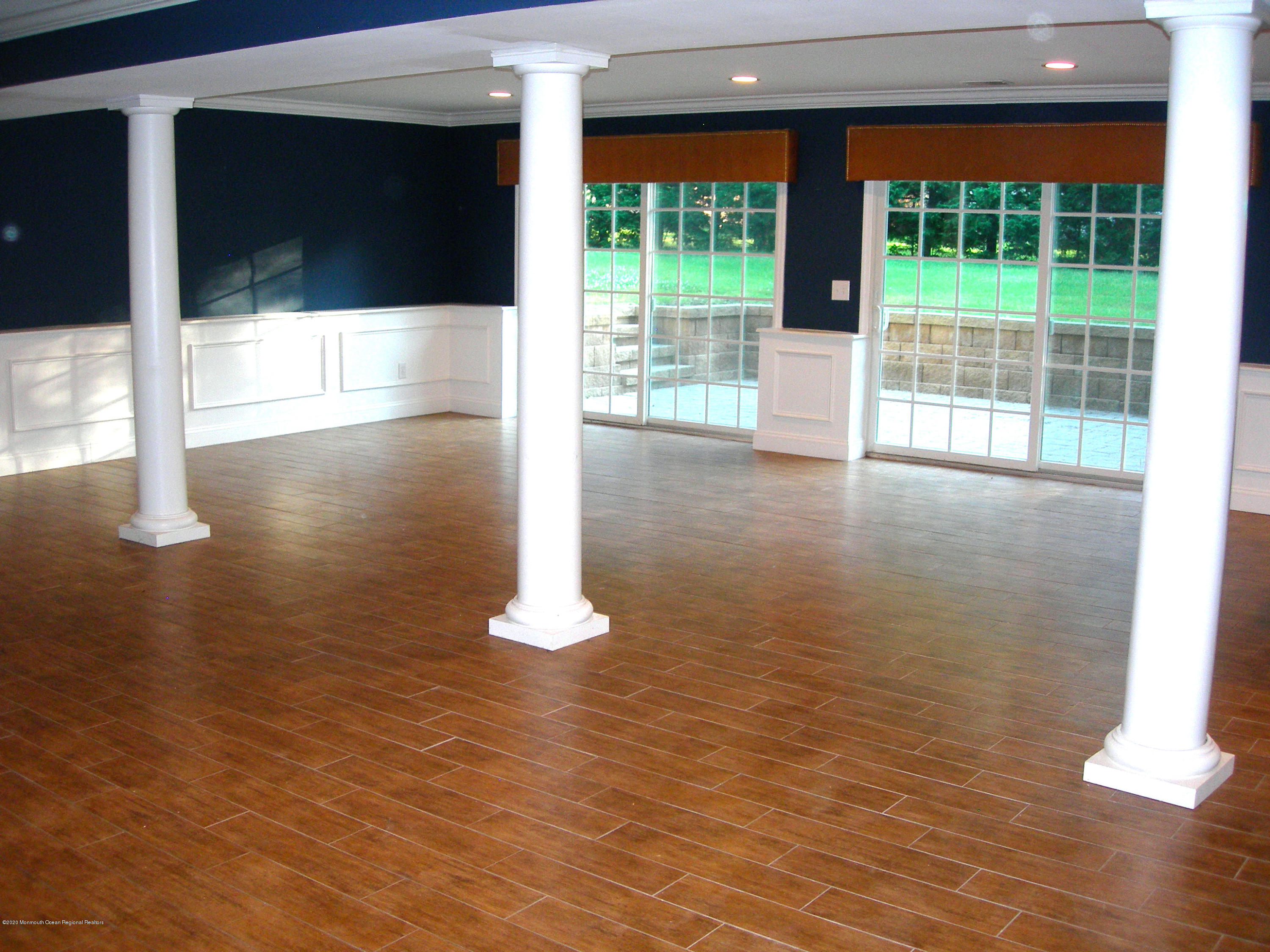 34 Shelbern Drive Lincroft, NJ 07738 - Photo 3 of 25 a view of empty room with wooden floor and fan