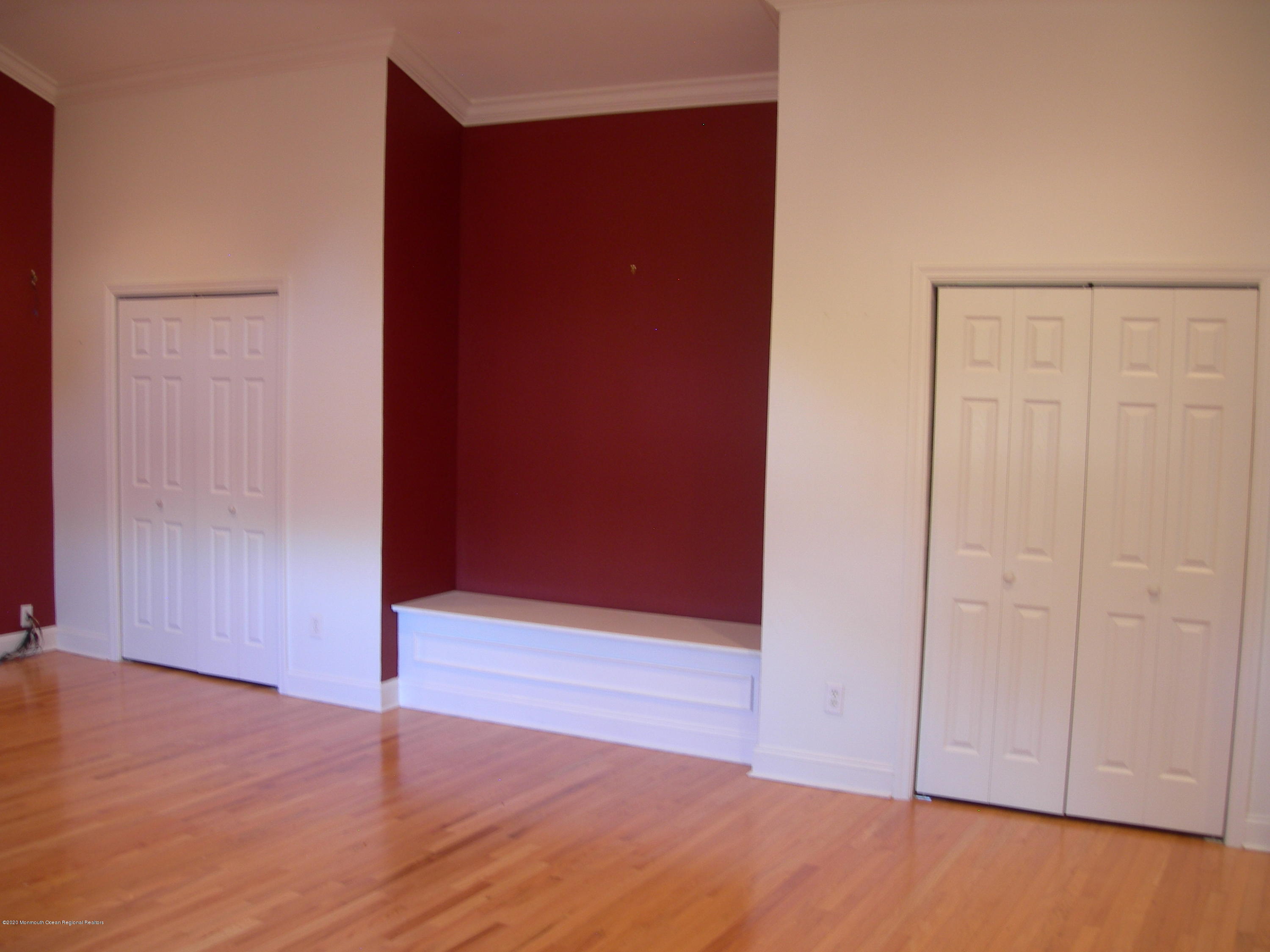 34 Shelbern Drive Lincroft, NJ 07738 - Photo 7 of 25 an empty room with wooden floor