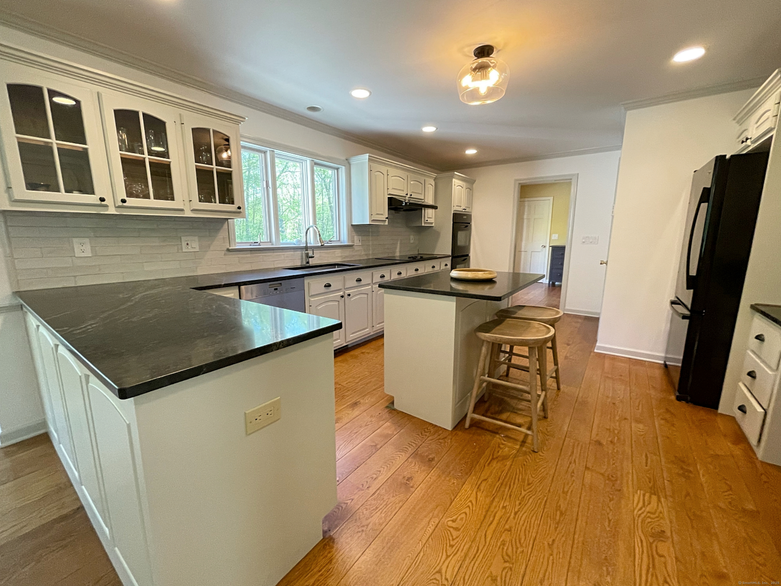 170 Rabbit Hill Road Warren, CT 06777 - Photo 11 of 28 a kitchen with stainless steel appliances granite countertop a sink a stove and refrigerator