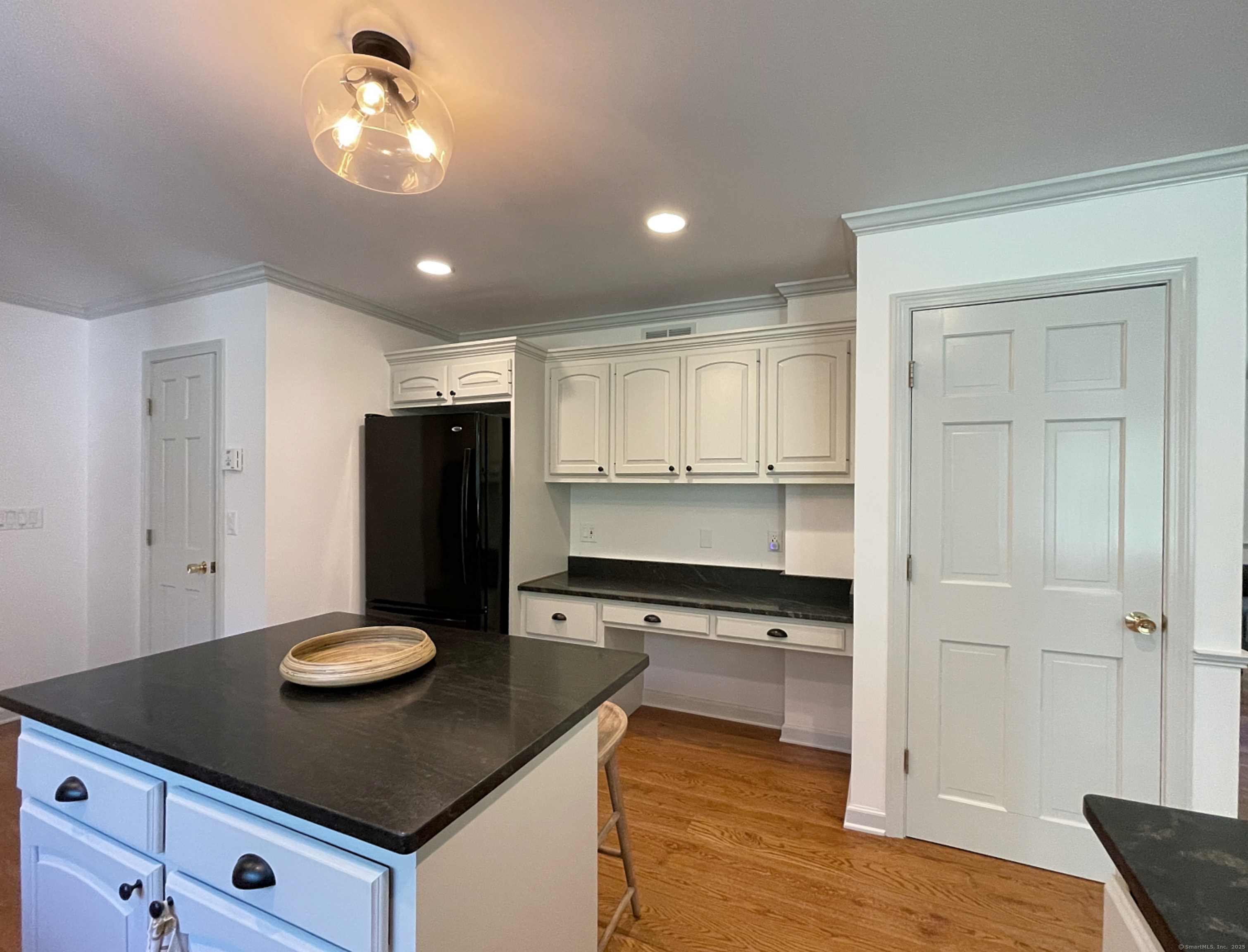 170 Rabbit Hill Road Warren, CT 06777 - Photo 12 of 28 a kitchen with a refrigerator and a stove top oven