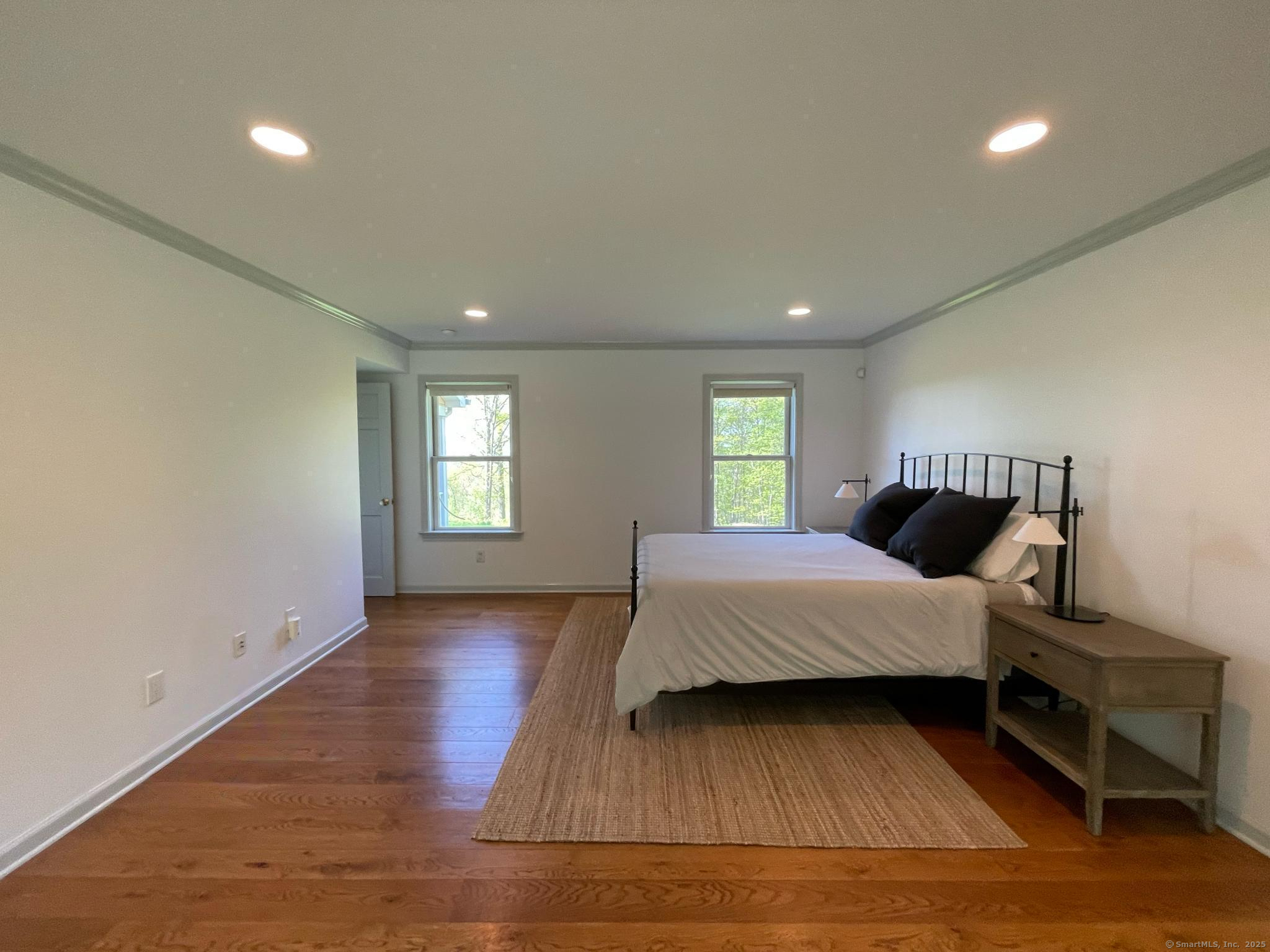 170 Rabbit Hill Road Warren, CT 06777 - Photo 19 of 28 a bedroom with a bed and window