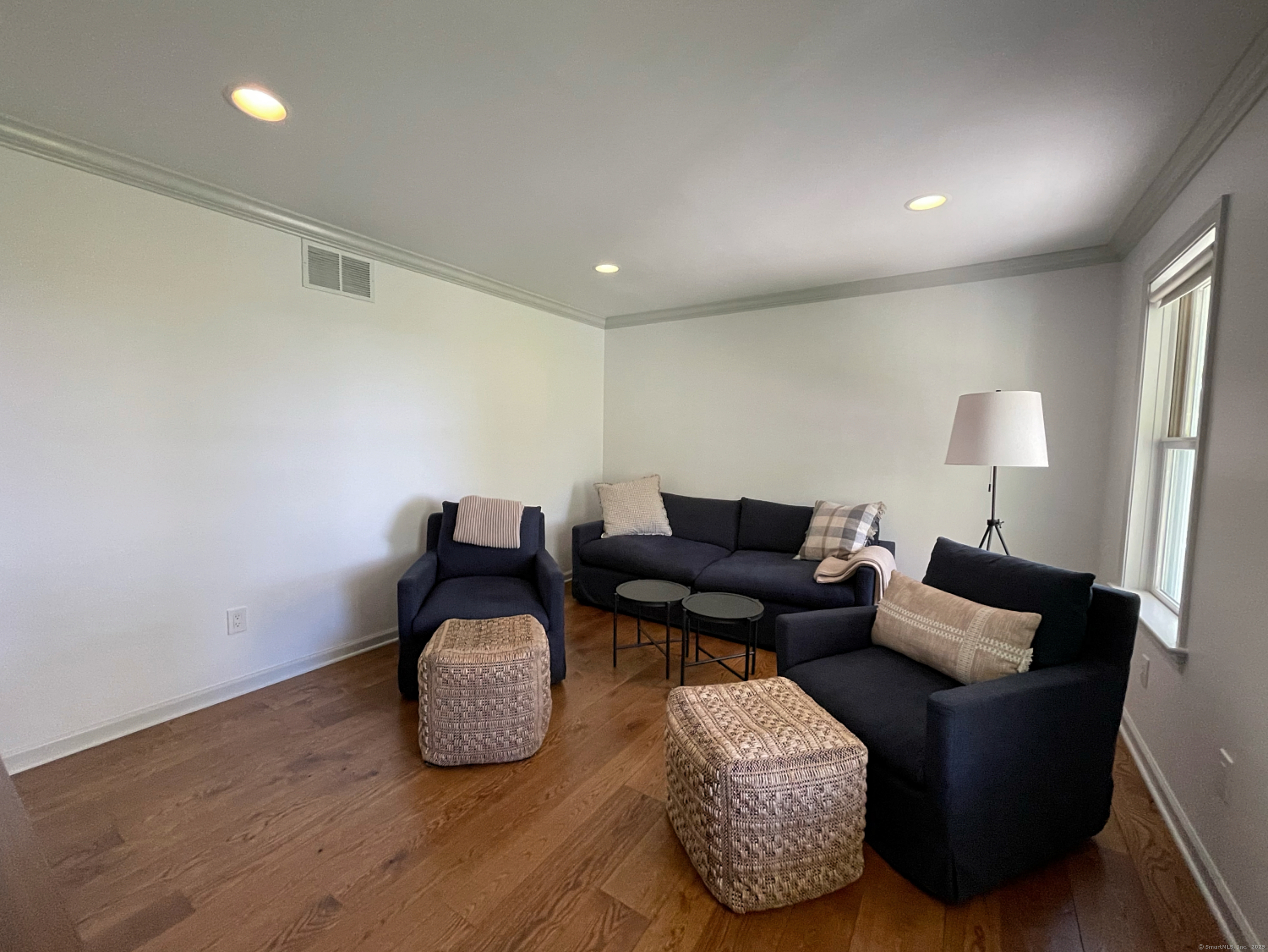 170 Rabbit Hill Road Warren, CT 06777 - Photo 21 of 28 a living room with furniture and a wooden floor
