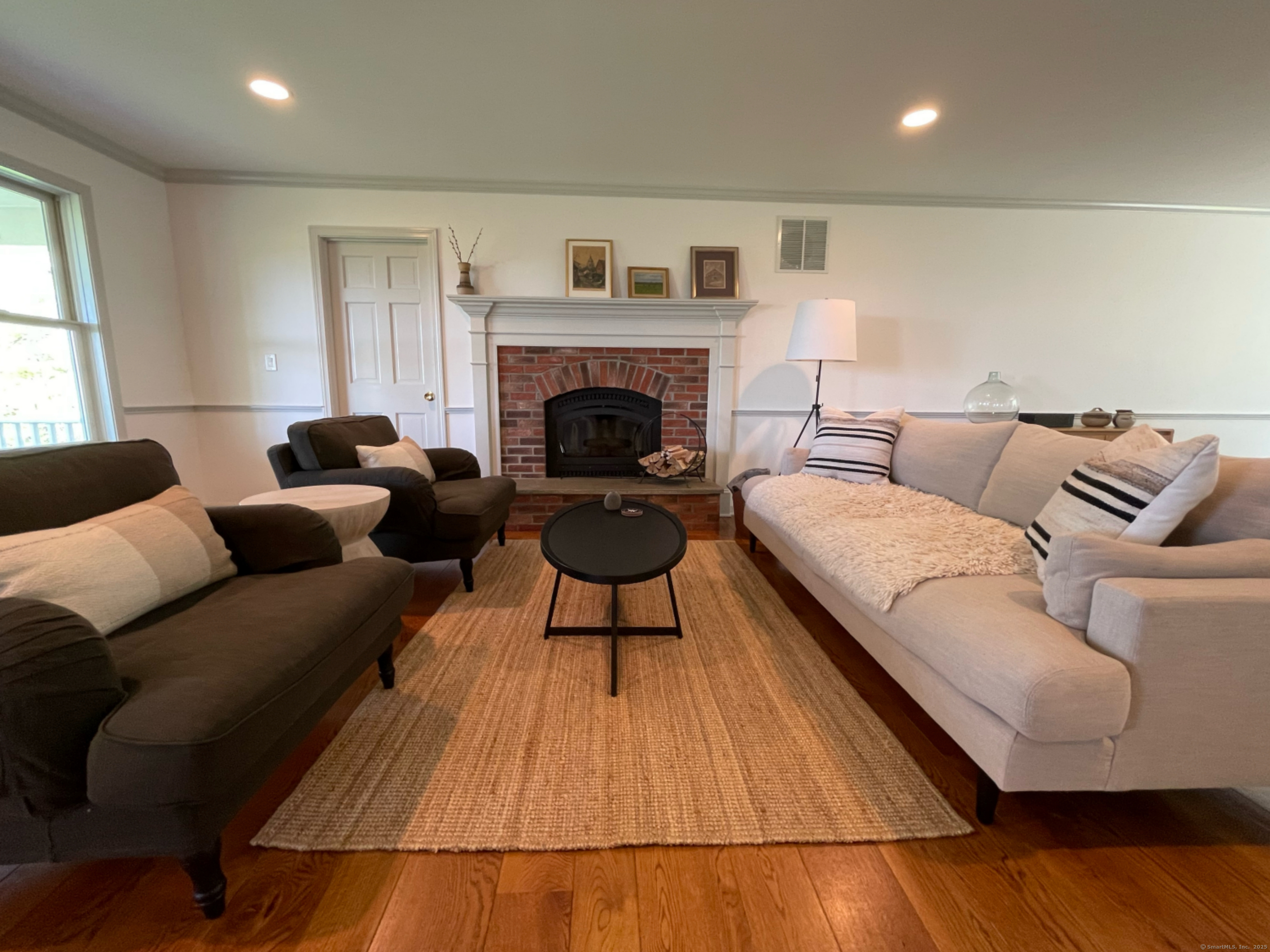 170 Rabbit Hill Road Warren, CT 06777 - Photo 7 of 28 a living room with furniture and a fireplace
