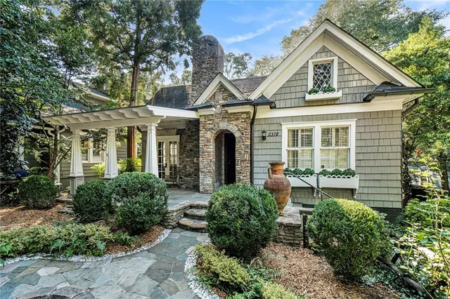 a front view of a house with garden