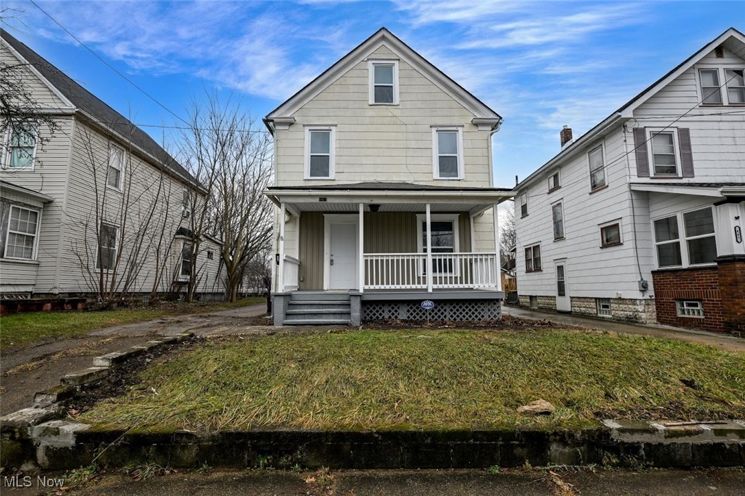 667 Elma Street Akron, OH 44310 - Photo 1 of 42 Traditional style home with a porch and a front lawn