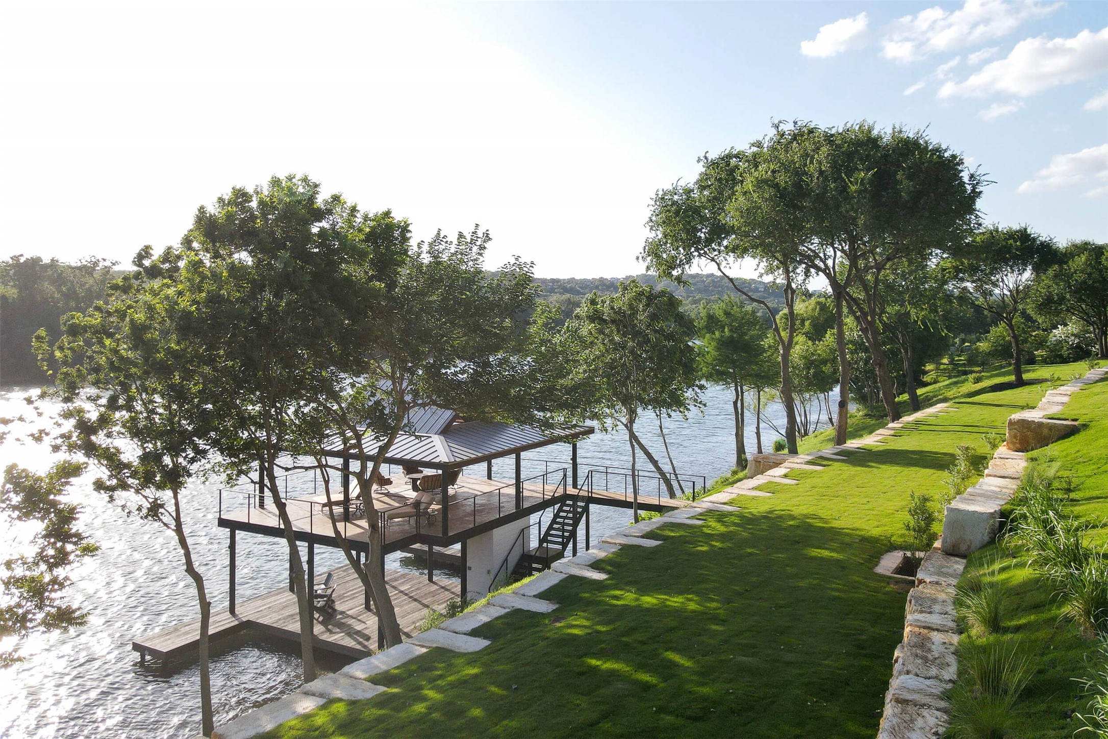 15016 Flat Top Ranch Road Austin, TX 78732 - Photo 10 of 40 Dock area featuring a yard and a water view