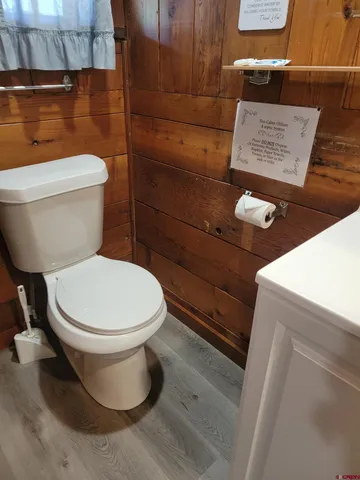 a white toilet sitting next to a bathroom sink