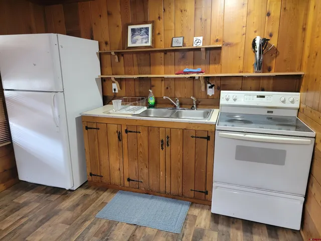 a kitchen with a stove and a refrigerator