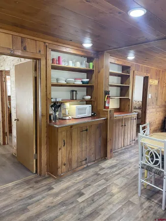 a kitchen with stainless steel appliances granite countertop a refrigerator and a stove