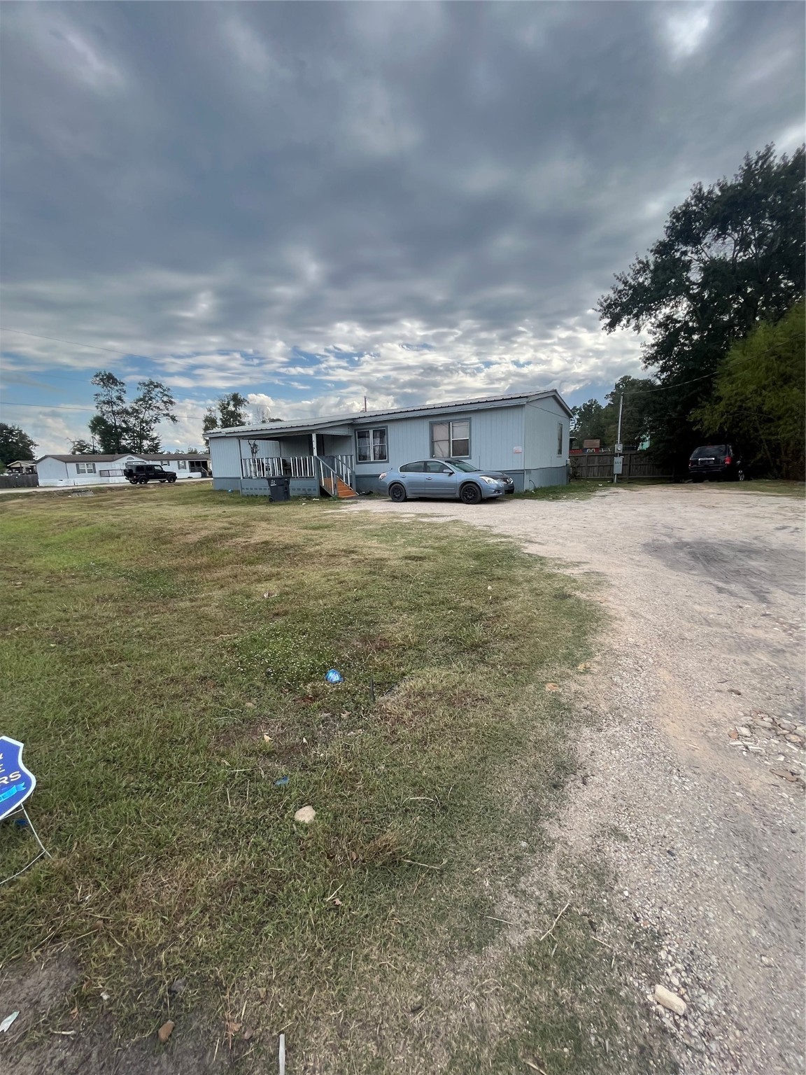 8009 Forest Trace Conroe, TX 77306 - Photo 16 of 16 a view of a big yard next to a building