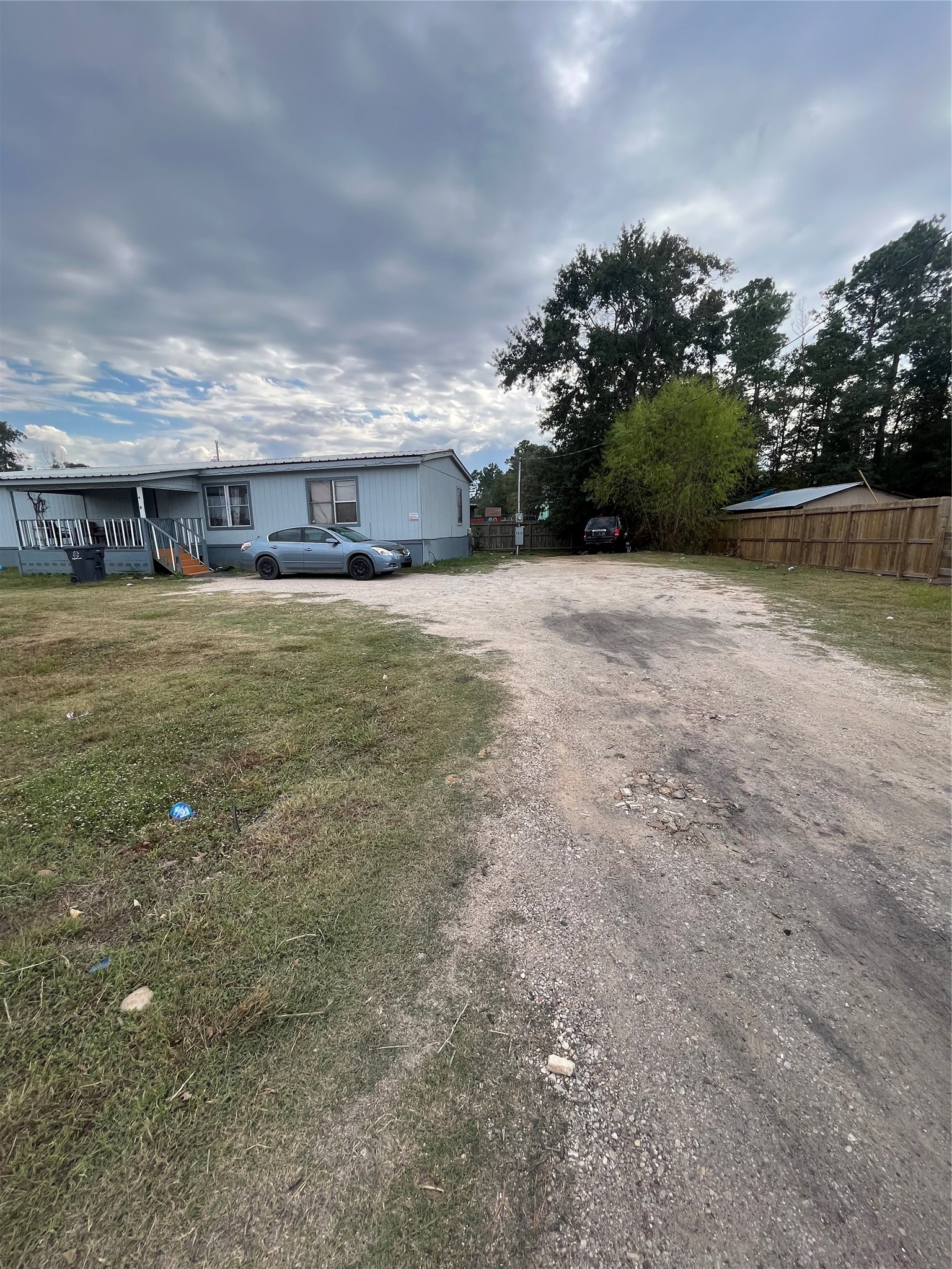 8009 Forest Trace Conroe, TX 77306 - Photo 5 of 16 a view of a house with a yard