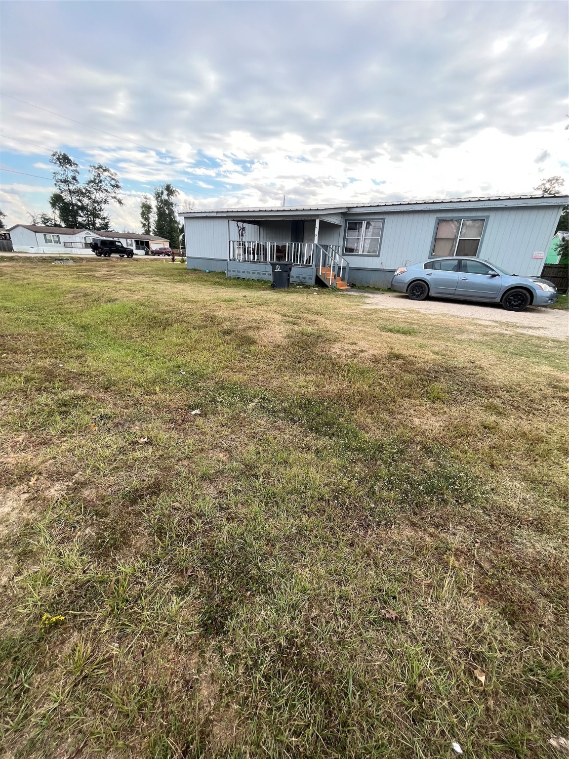 8009 Forest Trace Conroe, TX 77306 - Photo 6 of 16 a view of swimming pool with lawn chairs and large trees