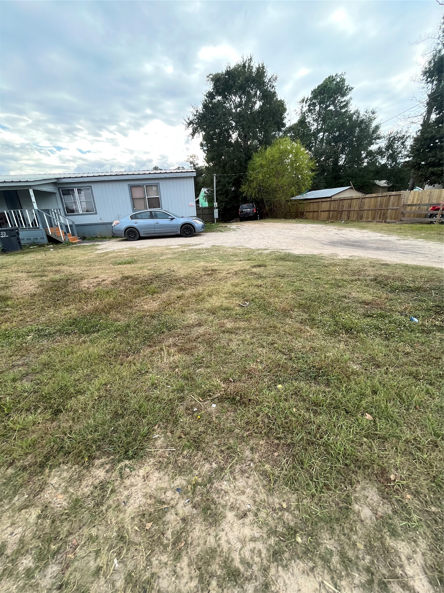 8009 Forest Trace Conroe, TX 77306 - Photo 9 of 16 a view of a house with a yard