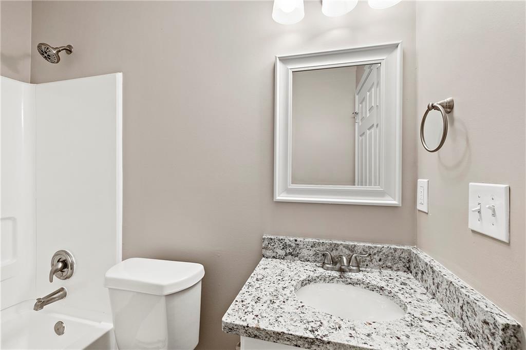 6020 Aderhold Way Alpharetta, GA 30004 - Photo 9 of 16 a bathroom with a sink and a toilet