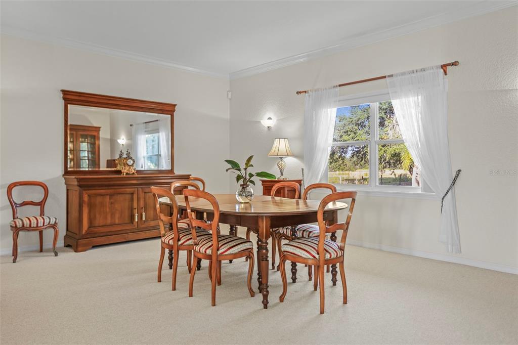 4503 North Rye Road Parrish, FL 34219 - Photo 11 of 68 a view of a dining room with furniture window and outside view