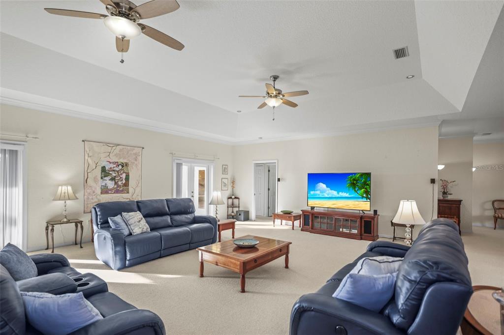 4503 North Rye Road Parrish, FL 34219 - Photo 14 of 68 a living room with furniture and a flat screen tv