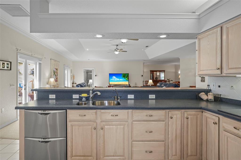 4503 North Rye Road Parrish, FL 34219 - Photo 19 of 68 a kitchen with white cabinets and sink