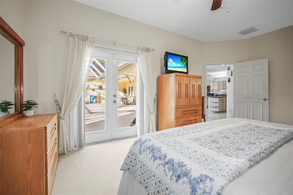 4503 North Rye Road Parrish, FL 34219 - Photo 26 of 68 a bedroom with a bed and a flat tv screen in it