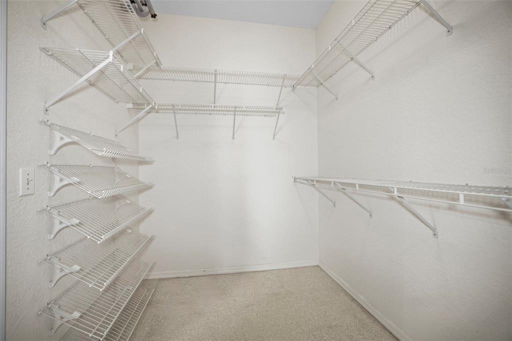 4503 North Rye Road Parrish, FL 34219 - Photo 27 of 68 a view of a room with racks on the wall