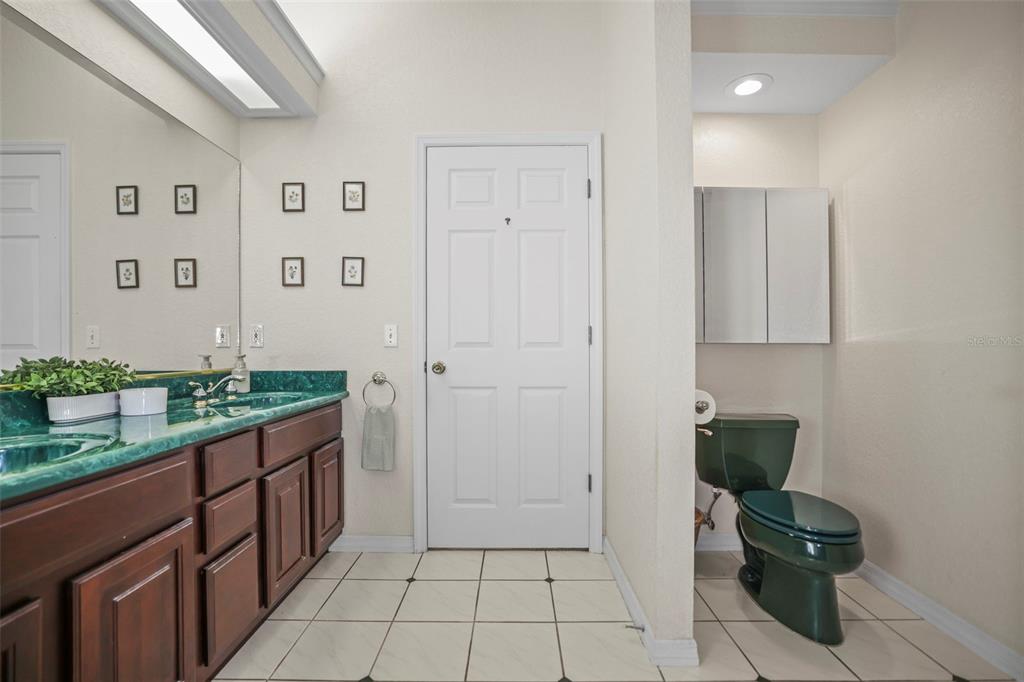 4503 North Rye Road Parrish, FL 34219 - Photo 30 of 68 a bathroom with a granite countertop sink and a toilet