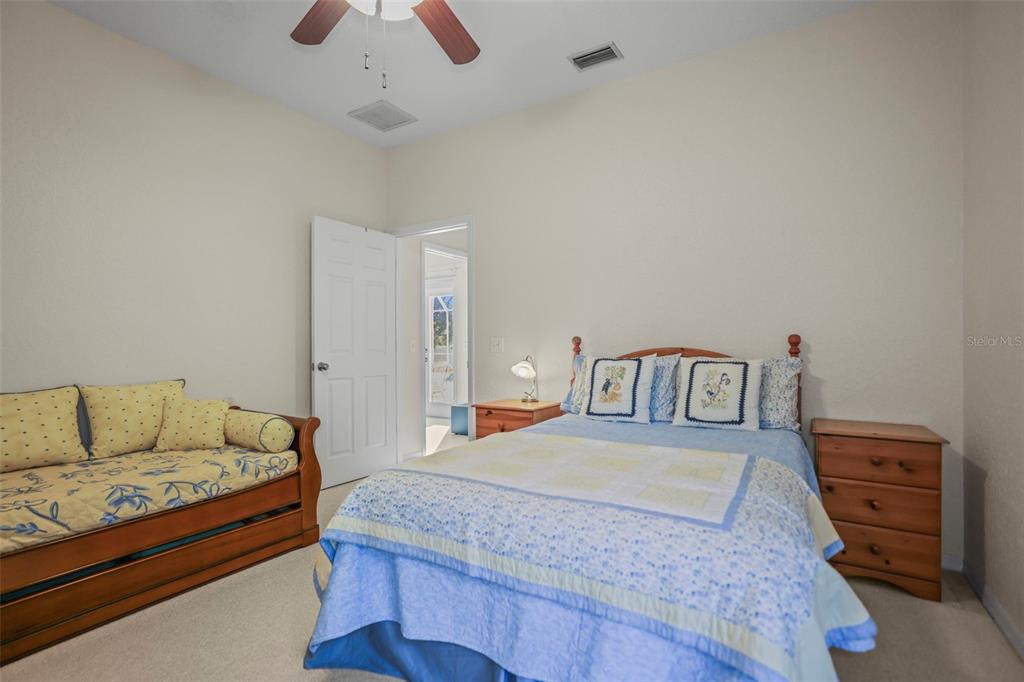 4503 North Rye Road Parrish, FL 34219 - Photo 34 of 68 a bedroom with a bed and a couch