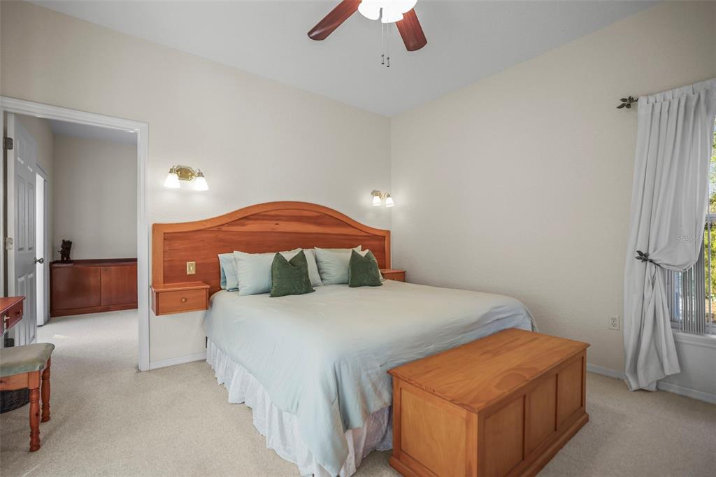 4503 North Rye Road Parrish, FL 34219 - Photo 36 of 68 a bedroom with a bed and a chandelier
