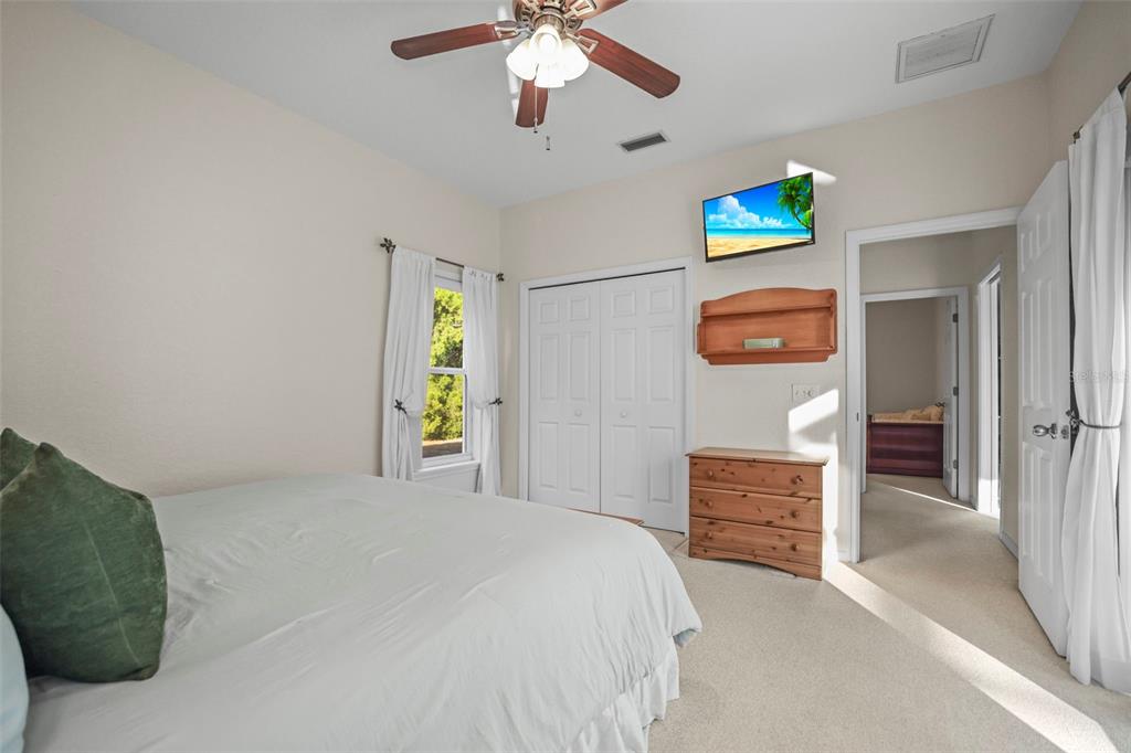 4503 North Rye Road Parrish, FL 34219 - Photo 37 of 68 a bedroom with a bed and a chandelier