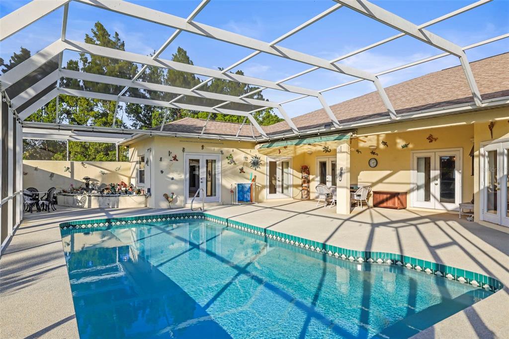 4503 North Rye Road Parrish, FL 34219 - Photo 45 of 68 a view of a swimming pool with a patio