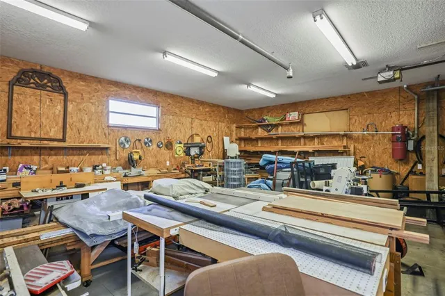 a view of a swimming pool with an outdoor seating and a garden
