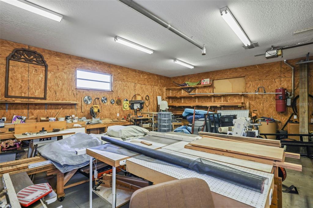 4503 North Rye Road Parrish, FL 34219 - Photo 50 of 68 a living room with lots of furniture and a table
