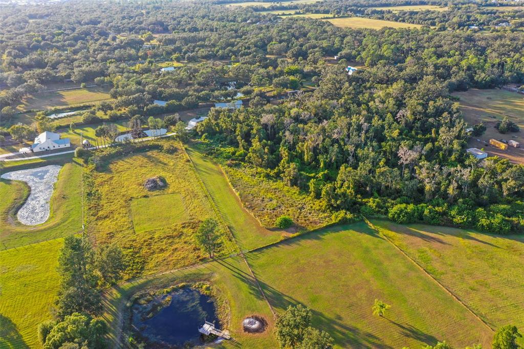 4503 North Rye Road Parrish, FL 34219 - Photo 60 of 68 a view of a swimming pool with an outdoor space and seating area