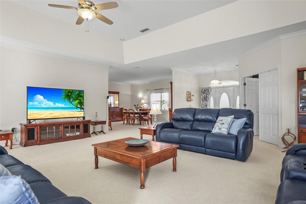 4503 North Rye Road Parrish, FL 34219 - Photo 10 of 68 a living room with furniture and a flat screen tv