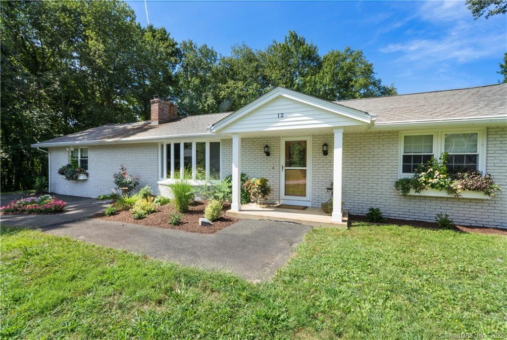 12 Mary Mac Loop Clinton, CT 06413 - Photo 1 of 1 a front view of a house with a garden and porch