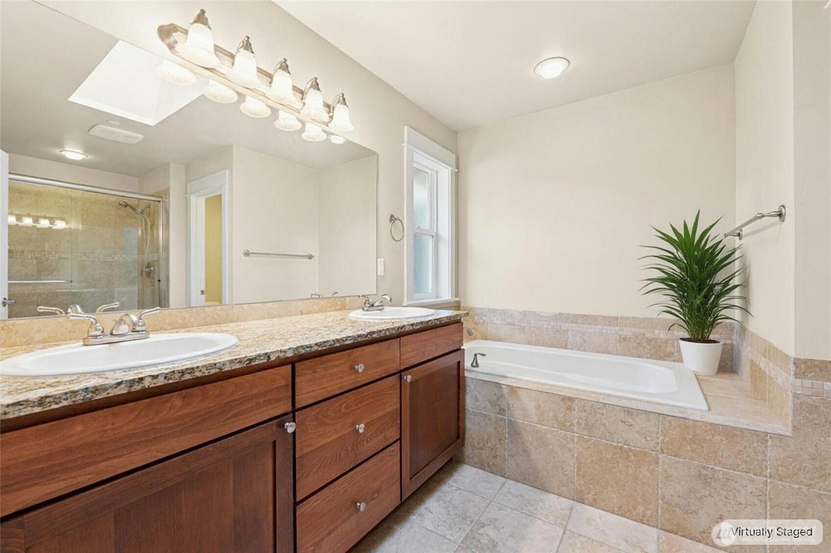 16555 Carlyle Hall Road North Shoreline, WA 98133 - Photo 13 of 27 a bathroom with a granite countertop sink a large mirror and a bathtub